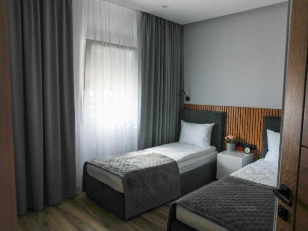 Apart-hotel Dream : photo 3 de la chambre chambre lits jumeaux avec salle de bains