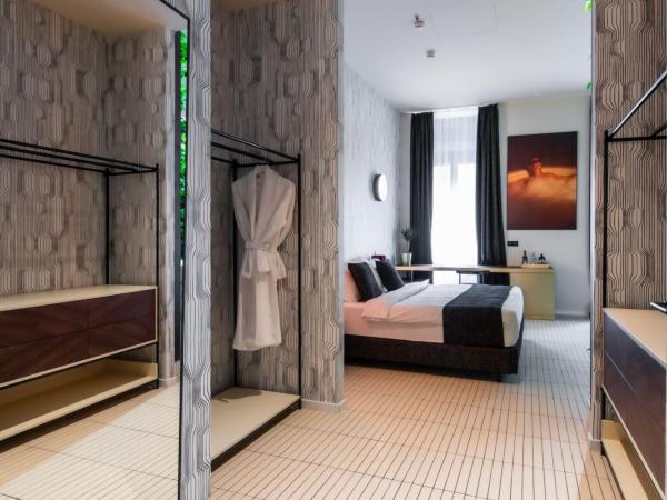 Stories Boutique Hotel : photo 3 de la chambre suite lit king-size avec baignoire spa