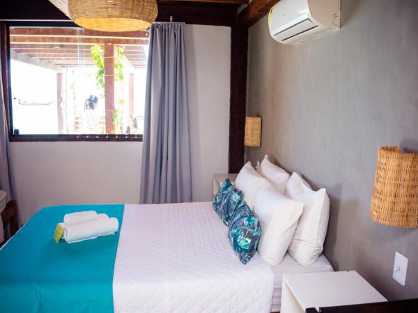 Bamboo Búzios Hostel : photo 3 de la chambre chambre triple standard - vue latérale sur mer