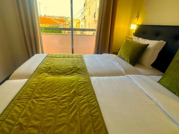 LISABONNA GUEST HOUSE : photo 4 de la chambre chambre lits jumeaux avec salle de bains commune