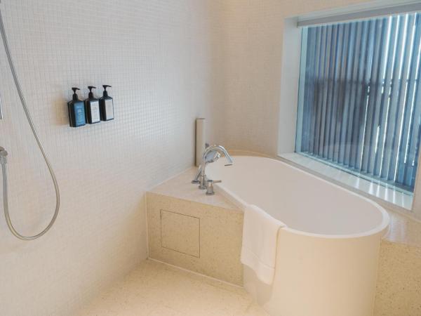 The Taikang Sanya, a Tribute Portfolio Resort : photo 6 de la chambre chambre deluxe avec 2 lits queen-size - vue sur océan