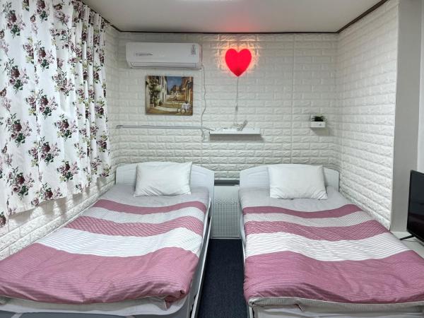 Jeong House : photo 10 de la chambre chambre triple avec salle de bains commune