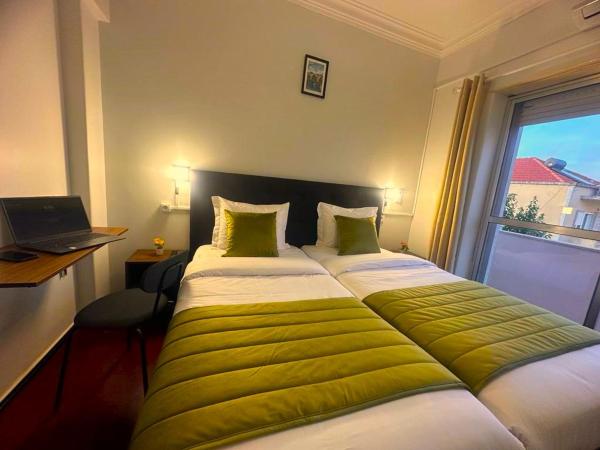 LISABONNA GUEST HOUSE : photo 1 de la chambre chambre lits jumeaux avec salle de bains commune