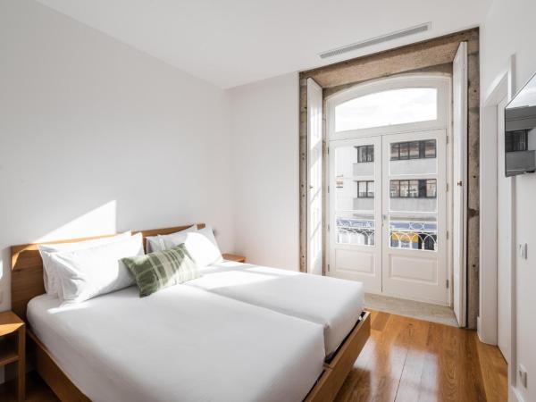 Avenida Viana Boutique Suites : photo 1 de la chambre chambre lits jumeaux avec balcon