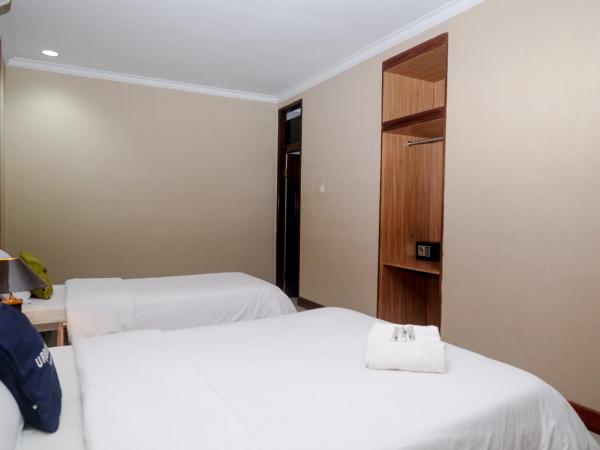 Urbanview Hotel Syariah Wisnugraha by RedDoorz : photo 6 de la chambre chambre familiale deluxe