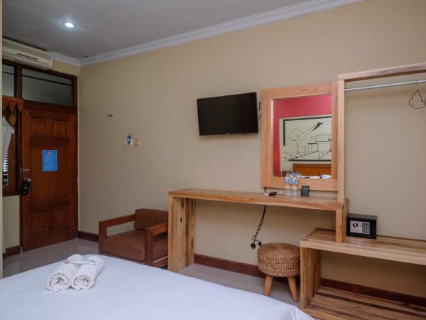 Urbanview Hotel Syariah Wisnugraha by RedDoorz : photo 1 de la chambre chambre double deluxe