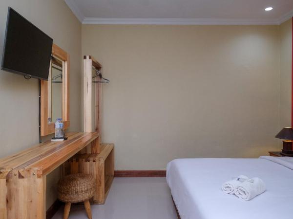 Urbanview Hotel Syariah Wisnugraha by RedDoorz : photo 6 de la chambre chambre double deluxe