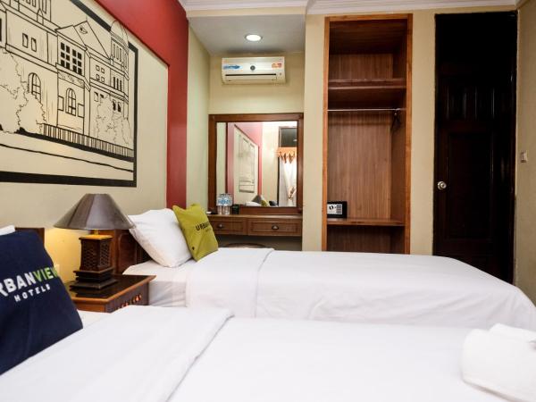 Urbanview Hotel Syariah Wisnugraha by RedDoorz : photo 3 de la chambre chambre lits jumeaux deluxe