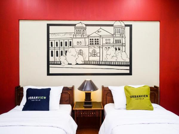 Urbanview Hotel Syariah Wisnugraha by RedDoorz : photo 1 de la chambre chambre lits jumeaux deluxe