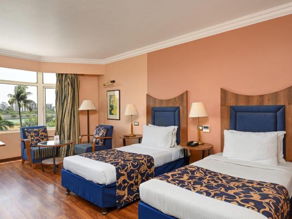 The Cama - A Sabarmati Riverfront Hotel : photo 3 de la chambre chambre double ou lits jumeaux supérieure - vue sur piscine