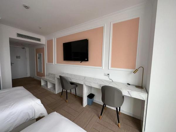 Magnificent International Hotel : photo 6 de la chambre chambre lits jumeaux deluxe