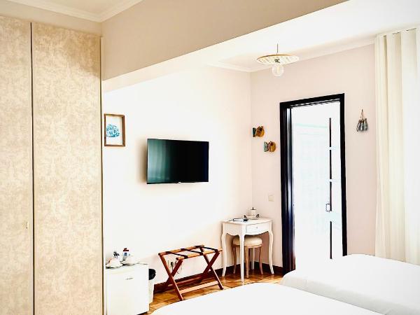 Senhor Gigi : photo 6 de la chambre chambre double ou lits jumeaux deluxe – vue sur jardin