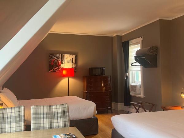 Les chambres des Grisons établissement sans contact : photo 2 de la chambre chambre quadruple