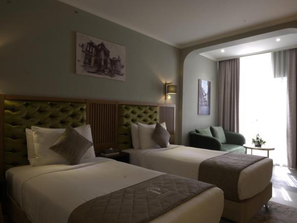 President Hotel : photo 2 de la chambre chambre lits jumeaux deluxe