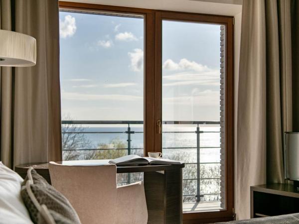 Hotel Różany Gaj - Destigo Hotels : photo 1 de la chambre appartement premium avec vue sur la mer