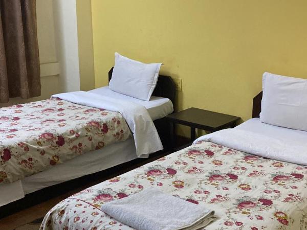 Bag Packer's Lodge : photo 2 de la chambre chambre lits jumeaux Économique avec salle de bains commune