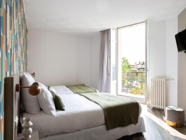 Hôtel Suzane : photo 5 de la chambre chambre quadruple confort