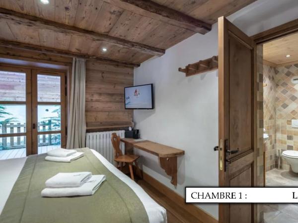 Chalet K120 - Village du Praz - Courchevel : photo 2 de la chambre chambre double ou lits jumeaux avec terrasse