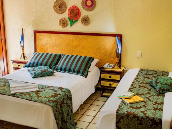 Castelo Beach Hotel : photo 1 de la chambre chambre triple de luxe avec vue latérale sur la mer