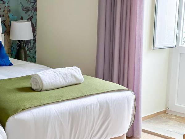 Guest House Jacarandá Faro : photo 3 de la chambre chambre lits jumeaux