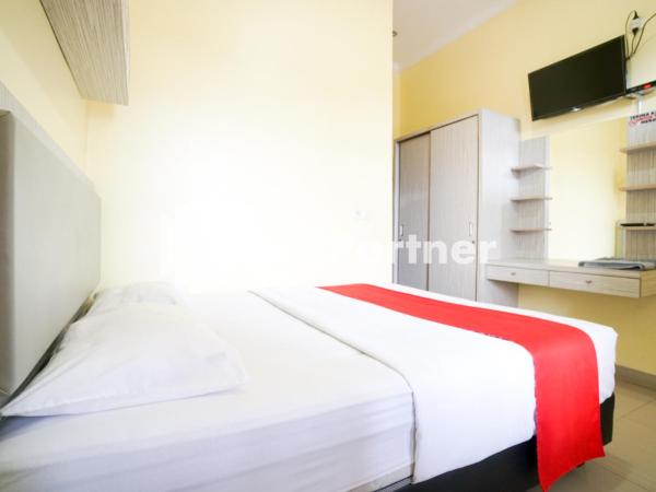 Indah Residence Syariah Mitra RedDoorz : photo 5 de la chambre chambre double standard