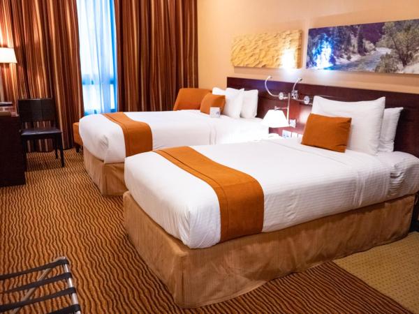 City Seasons Hotel & Suites Muscat : photo 5 de la chambre chambre familiale