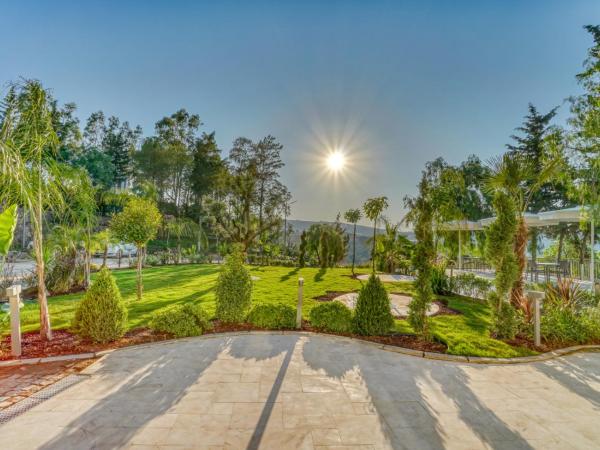 Olira Türkbükü Residences : photo 4 de la chambre appartement - vue sur jardin