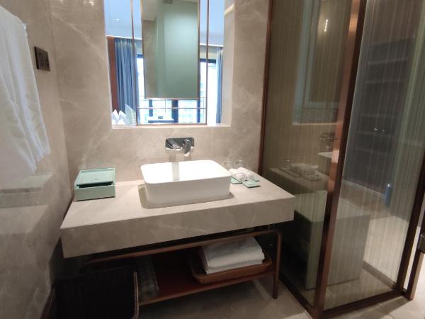 Zhongzhou International Apartment : photo 9 de la chambre chambre lits jumeaux deluxe