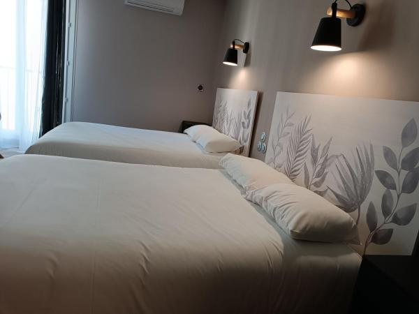 Contact Hôtel Limoges - HOTEL DES DEUX MOULINS : photo 3 de la chambre chambre quadruple