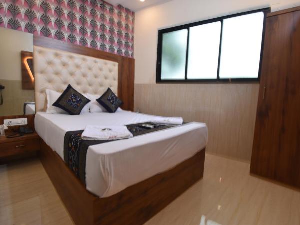 Hotel Dream Palace Residency - Near LBS Marg Kural West : photo 9 de la chambre chambre deluxe