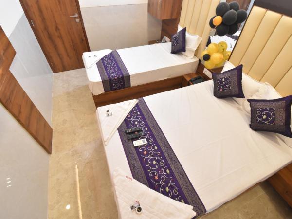 Hotel Dream Palace Residency - Near LBS Marg Kural West : photo 6 de la chambre chambre double ou lits jumeaux
