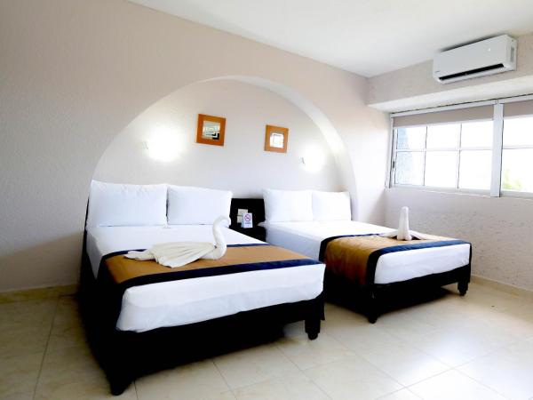 Hotel Caribe Internacional Cancun : photo 9 de la chambre chambre lits jumeaux supérieure