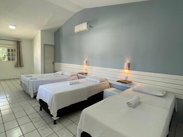 Pousada Encanto dos Mares : photo 1 de la chambre chambre quadruple