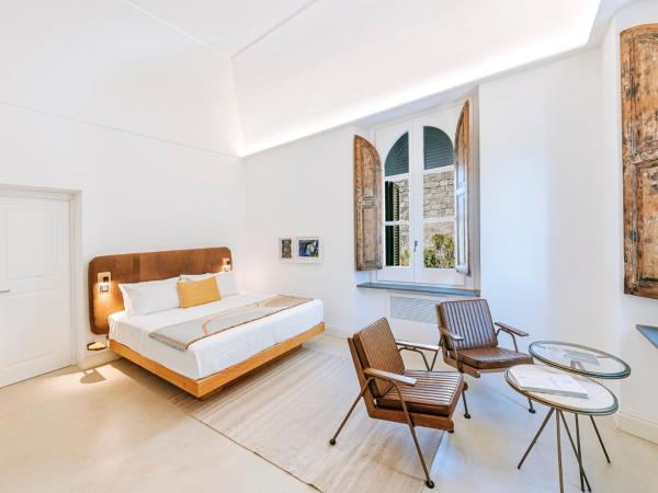 Faro Punta Imperatore : photo 1 de la chambre chambre double deluxe - vue latérale sur mer