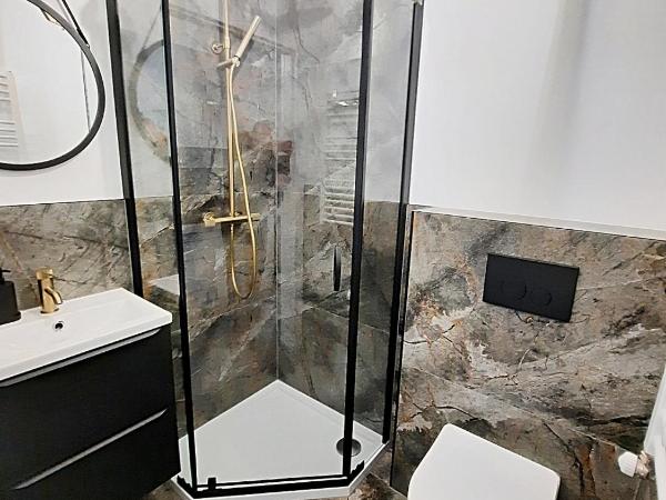 Royal Smart Apartments Cracow : photo 5 de la chambre chambre double ou lits jumeaux - vue sur jardin