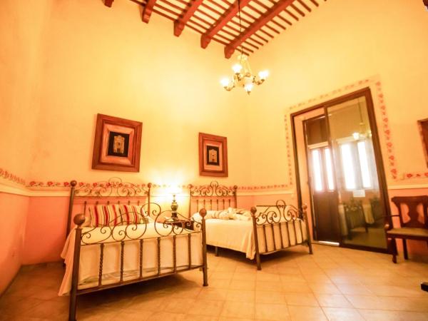 Hotel Boutique La Mision De Fray Diego : photo 5 de la chambre suite deluxe 2 double beds & garden view