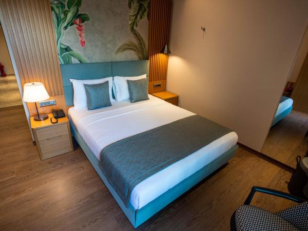 Palm Hills Bodrum Hotel : photo 10 de la chambre chambre lit king-size - vue sur jardin