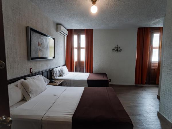 Hotel Don Quijote Plaza - Guadalajara Centro Historico : photo 1 de la chambre chambre double avec 2 lits doubles