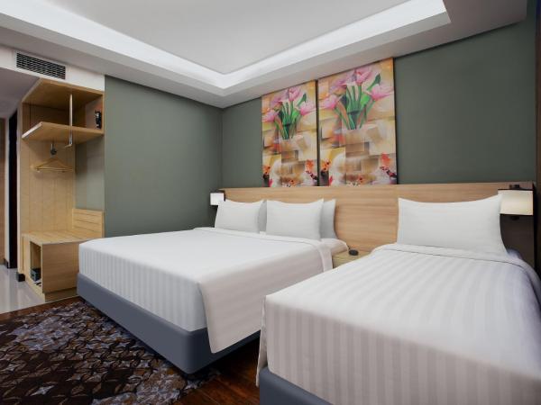 Harper Malioboro Yogyakarta by ASTON : photo 2 de la chambre suite familiale