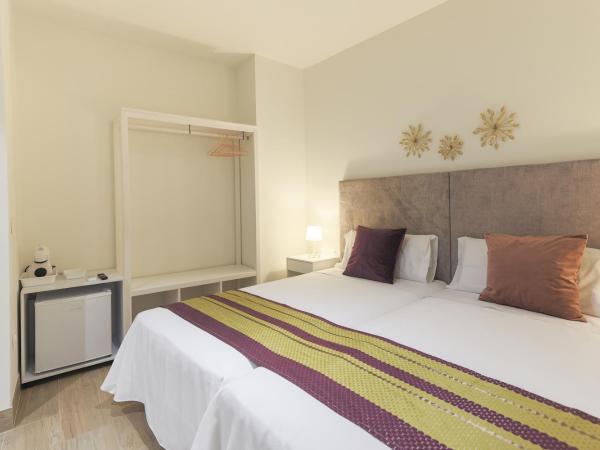 Dorinda Rooms : photo 7 de la chambre chambre triple supérieure