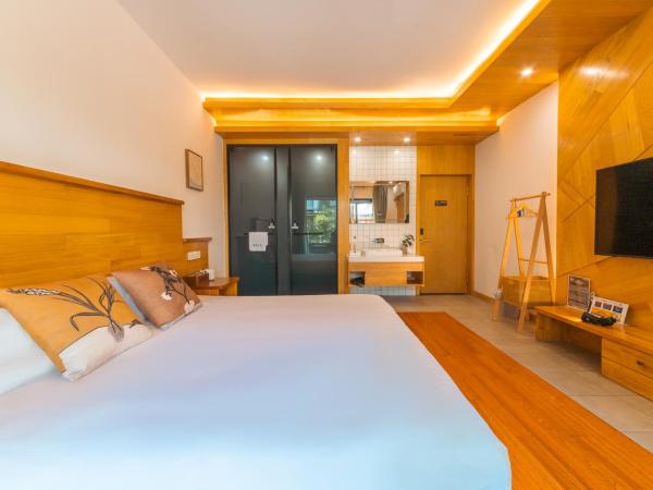 MK Inn : photo 2 de la chambre chambre lit king-size - vue sur jardin