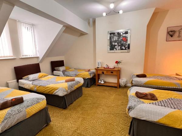 Castle Lodge Guest House 86-88 Sheil Rd L6 3AF : photo 1 de la chambre chambre familiale (5 adultes)