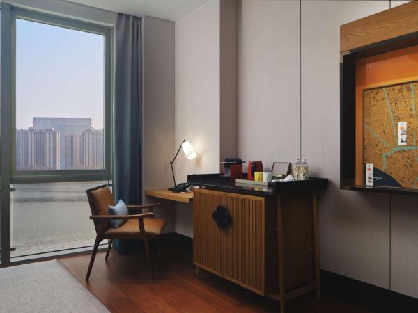 Canopy By Hilton Hangzhou Jinsha Lake : photo 2 de la chambre chambre lit king-size deluxe - vue sur lac