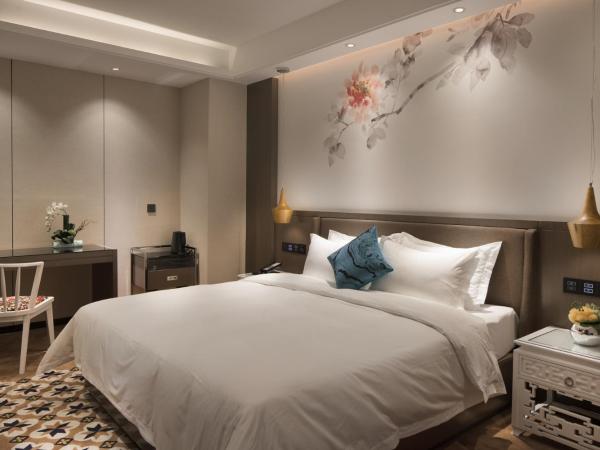 Paco Hotel Dongpu Guanghzou -Free Shuttle Bus for Canton Fair : photo 1 de la chambre chambre lit queen-size supérieure (sans fenêtre)