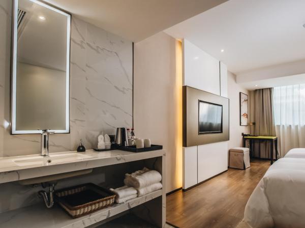 Orienwit Hotel-Free Shuttle Bus fir Canton Fair : photo 8 de la chambre chambre lits jumeaux deluxe