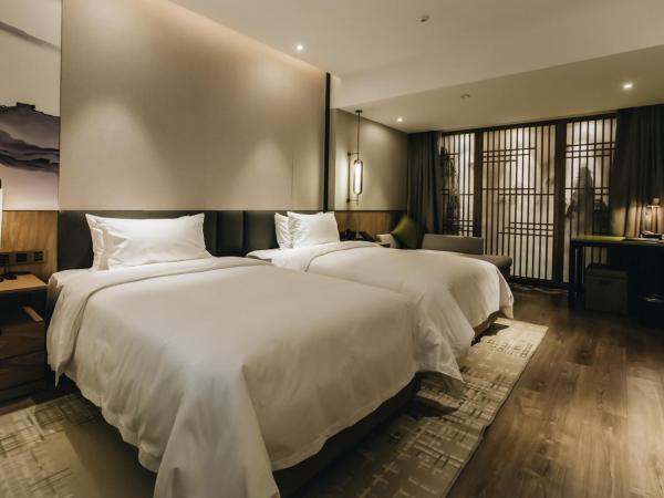 Orienwit Hotel-Free Shuttle Bus fir Canton Fair : photo 9 de la chambre chambre lits jumeaux supérieure