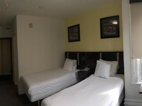 Casa Loma Hotel : photo 1 de la chambre hébergement lits jumeaux deluxe