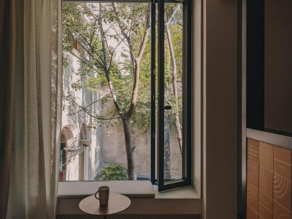 Hotel Palau Fugit : photo 5 de la chambre chambre lits jumeaux supérieure - vue sur jardin