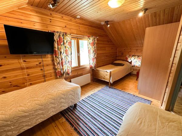 Napapiirin Järvilomat : photo 4 de la chambre cottage 4 chambres avec sauna