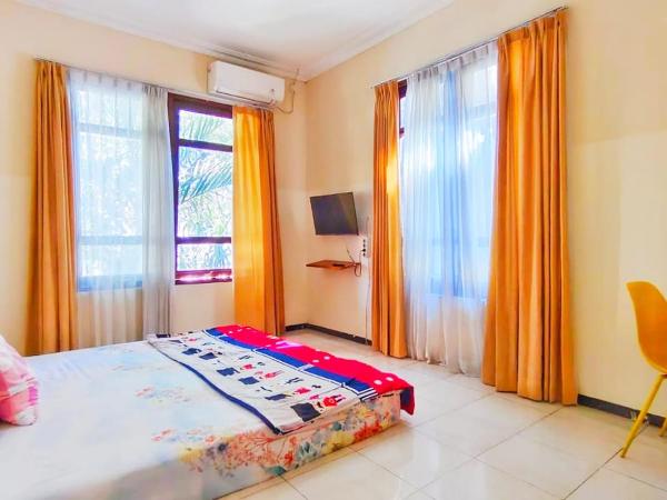 Green Surabaya Homey : photo 1 de la chambre chambre triple